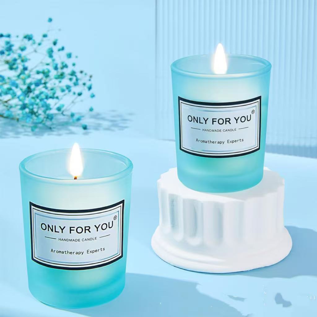 Two blue candles labeled 'Only For You' on a light blue background with decorative elements.