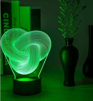 3D heart-shaped lamp emitting a green glow on a dark background with decorative elements.