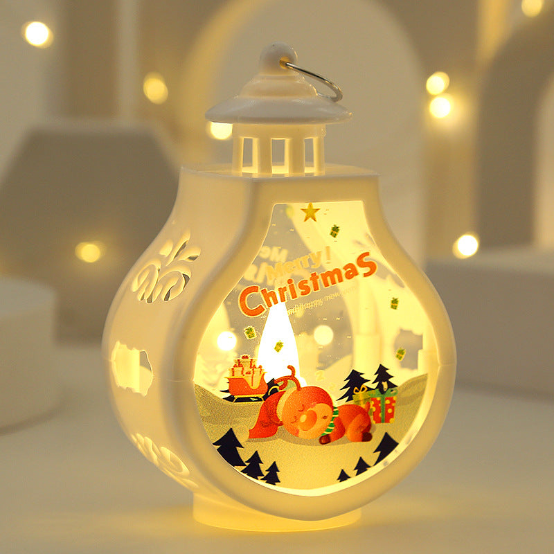 Decorative lantern with Christmas scene inside, glowing softly against a blurred background.