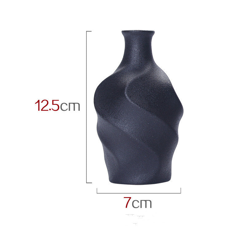 Black textured vase with dimensions indicated on a white background