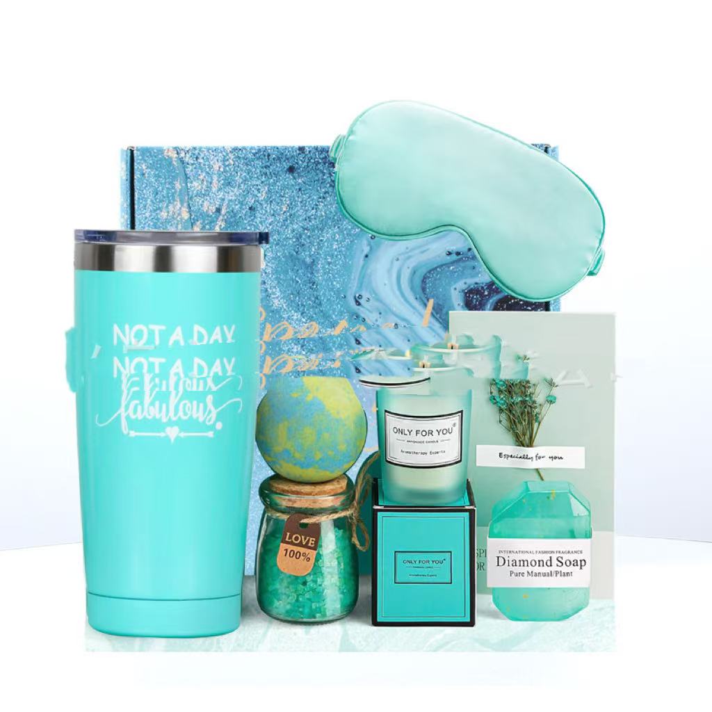 Collection of turquoise-themed products including a tumbler, candle, soap, and eye mask on a white background.