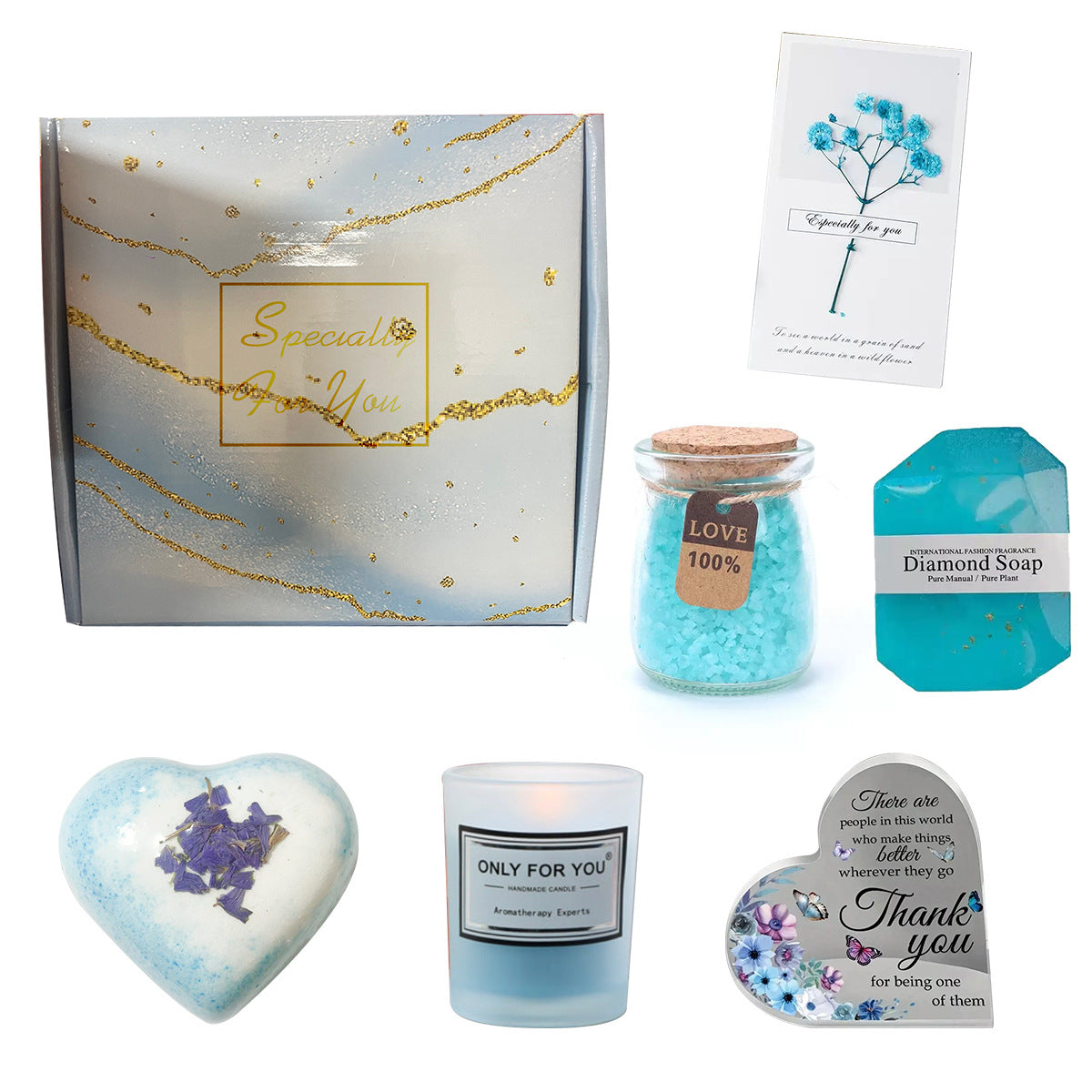 Collection of gift items including a candle, soap, and cards on a white background