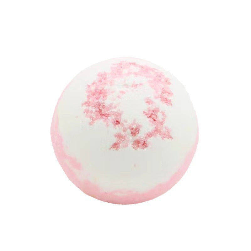 Bath bomb with pink floral pattern on a white background