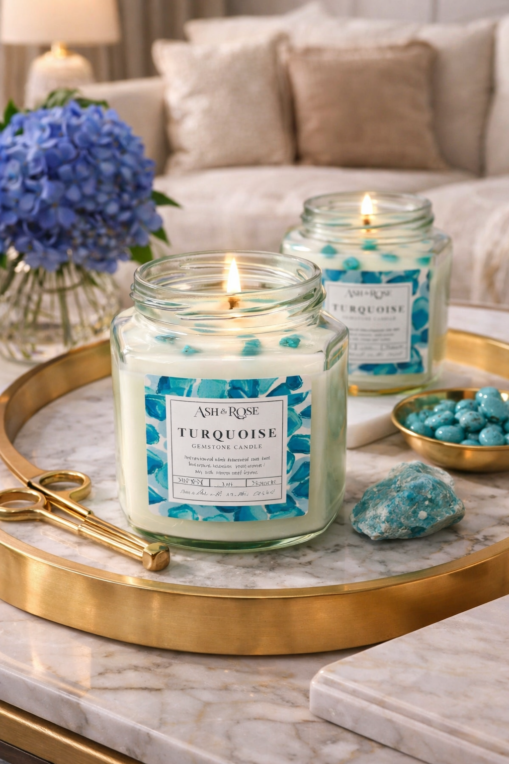 Two lit candles labeled 'Turquoise' on a marble tray with decorative elements.