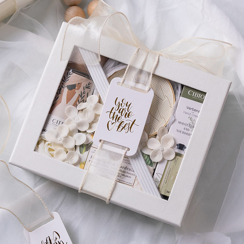 Gift box with a decorative tag inside, featuring a product with visible branding.